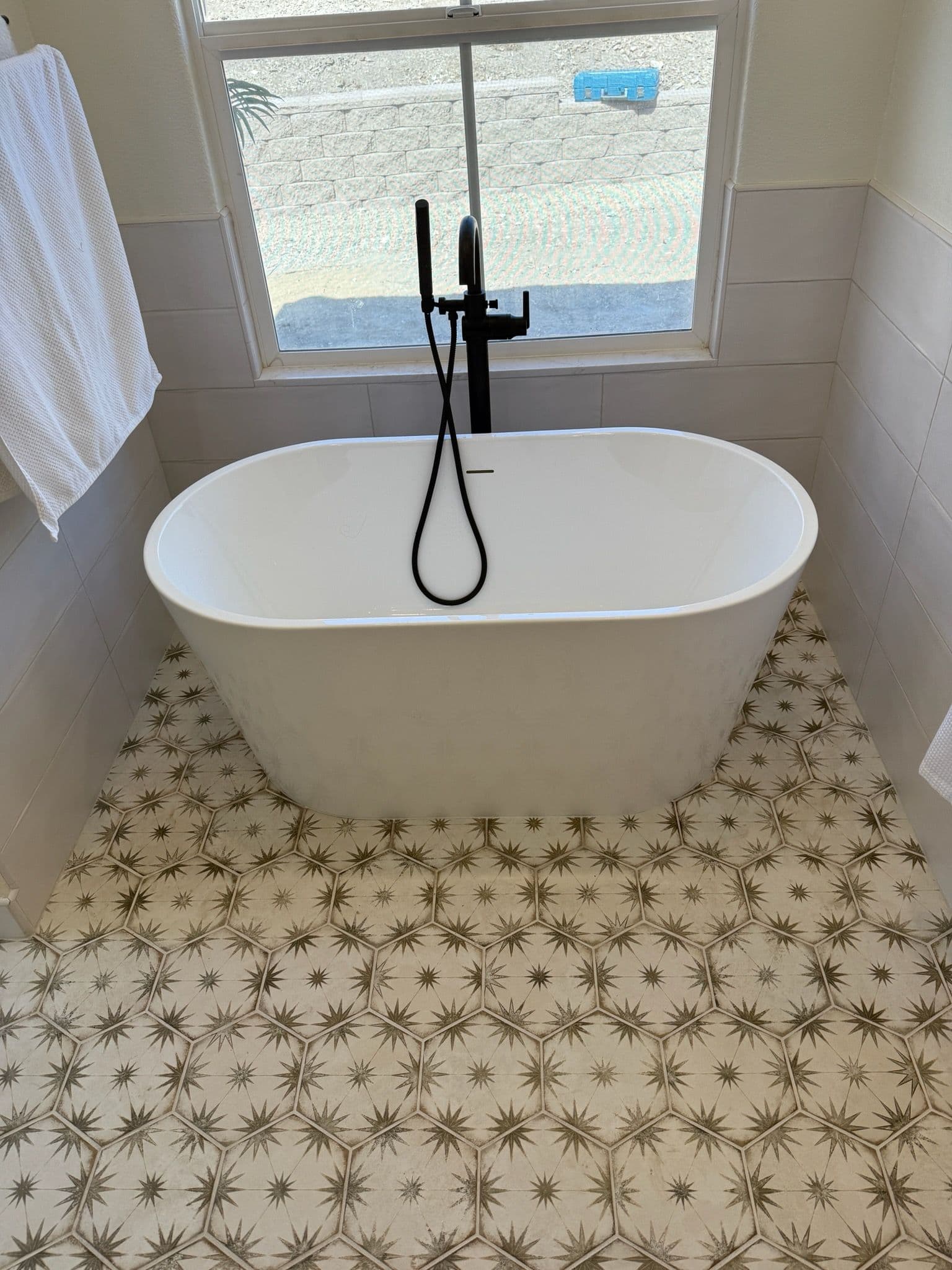 Bathroom Makeover with Elegant Tub and Faucet image